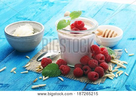 Beautiful Appetizer Pink Raspberries Fruit Smoothie Or Milk Shake In Glass Jar With Berries Backgrou