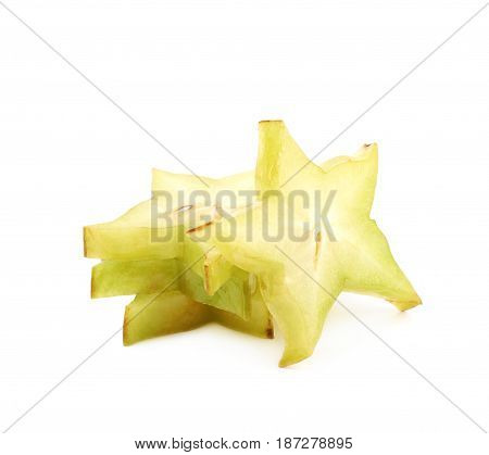 Pile of sliced carambola starfruit fruits isolated over the white background