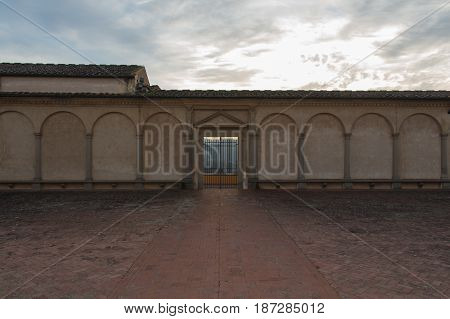 Italy Florence - December 24 2016: the view of the entrance of Florence Charterhouse church Certosa di Galluzzo di Firenze. View from inner courtyard on December 24 2016 in Florence Tuscany Italy.