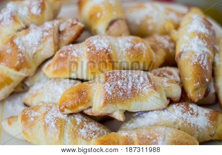 Fresh baked bun with jam. Close up.