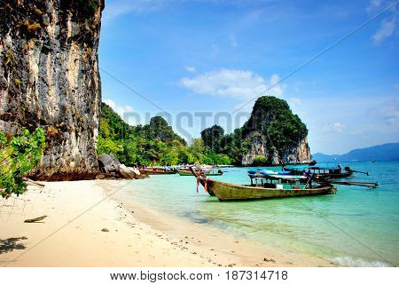 Longtail boats visiting the golden beaches in Thailand