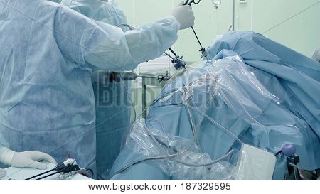 Laparoscopic surgery of the abdomen. The team of medical specialists conducting laparoscopic surgery.