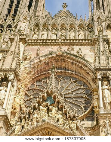 Fragment of the main facade above the central portal of the Cathedral Notre-Dame de Reims built in the 13th century France