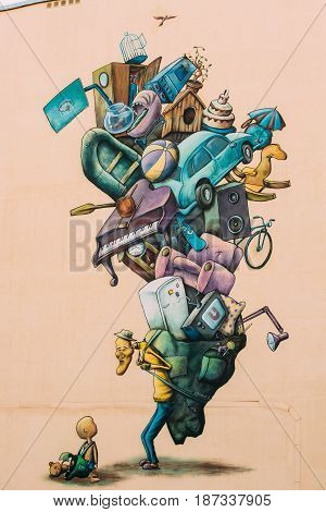 Gomel, Belarus - April 29, 2017: Mural by the Belarusian street artist Eugene Mutus covers a wall of residential house in Vetkovskaya street.