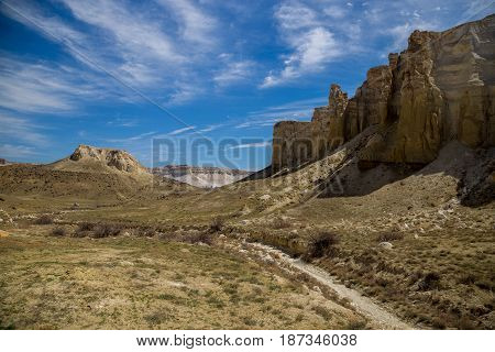 Rocks of a fantastic unusual shape and dry creek in the desert of Kazakhstan