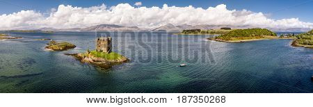 Aerial of the historic castle Stalker in Argyll, Scotland