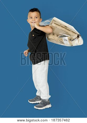 Little Boy Holding Separate Papers Studio Portrait