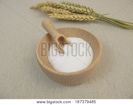 Dextrose from wheat starch in wooden bowl