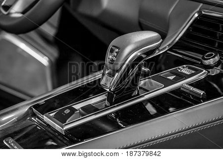 STUTTGART GERMANY - MARCH 04 2017: The shift knob of the full-size luxury car Porsche Panamera Turbo 2016. Europe's greatest classic car exhibition 