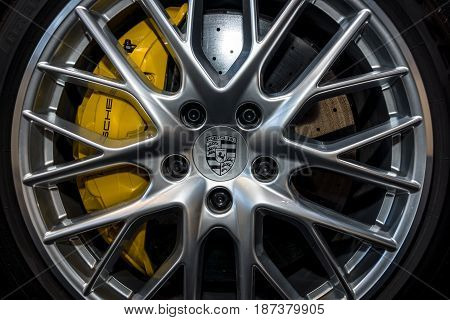 STUTTGART GERMANY - MARCH 04 2017: The braking system of the full-size luxury car Porsche Panamera Turbo 2016. Europe's greatest classic car exhibition 