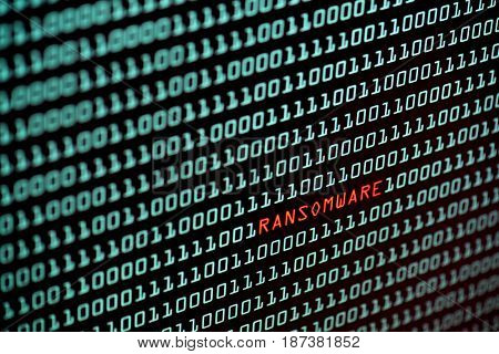 Ransomware or Wannacry text and binary code concept from the desktop screen. concept background, selective focus