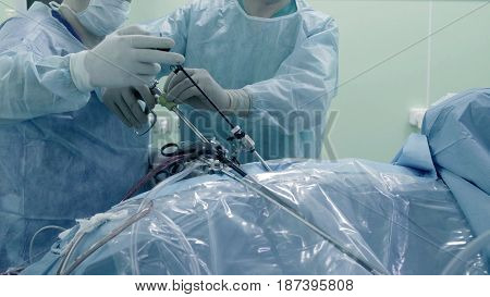 Laparoscopic surgery of the abdomen. The team of medical specialists conducting laparoscopic surgery.