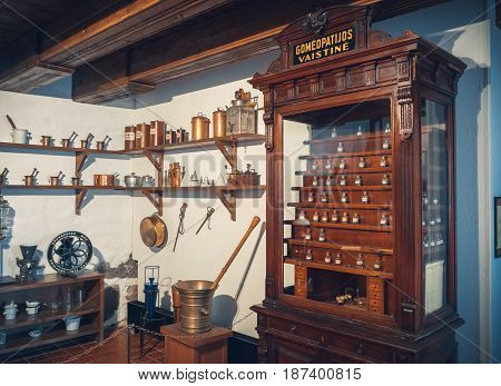 Kaunas, Lithuania - May 12, 2017: Old Apothecary Cabinet Of Homeopathy Drugs And Shelf With Retro Ph