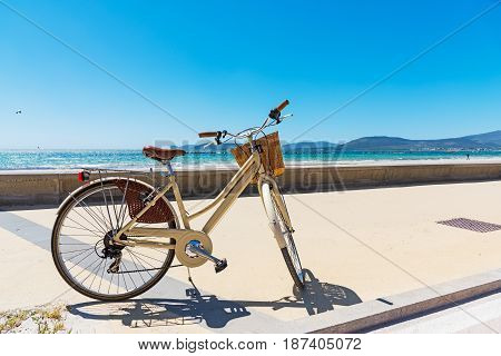 a vintage bicycle by Alghero shore, Italy