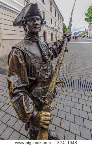 ALBA IULIA Romania - APRIL 30 2017: Bronze statue with soldier in front of Third Gate of the City in Citadel of Alba Iulia city.