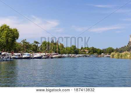 TURKEY, MUGLA ,DALYAN, - 5 MAY , 2017: The Dalyan River with tourist boats in the straits of the river