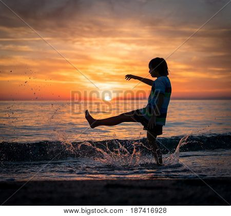 Happy boy enjoying the beach