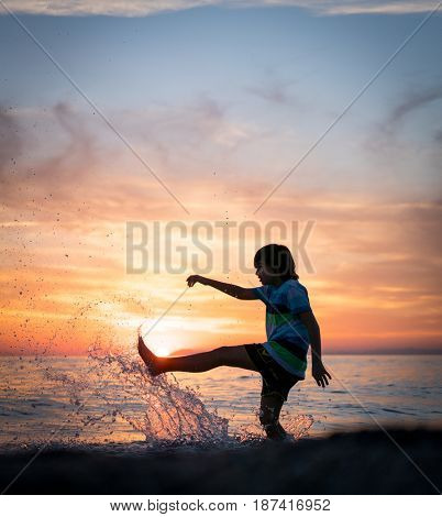 Happy boy enjoying the beach