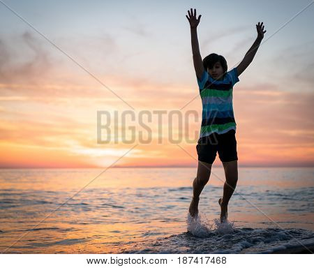 Happy boy enjoying the beach