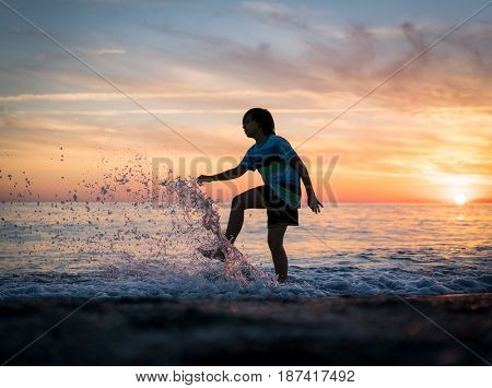 Happy boy enjoying the beach