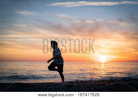 Happy boy enjoying the beach