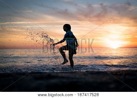Happy boy enjoying the beach