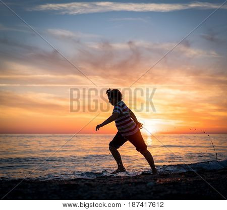 Happy boy enjoying the beach