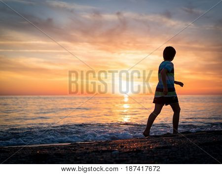 Happy boy enjoying the beach