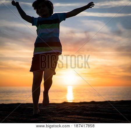 Happy boy enjoying the beach