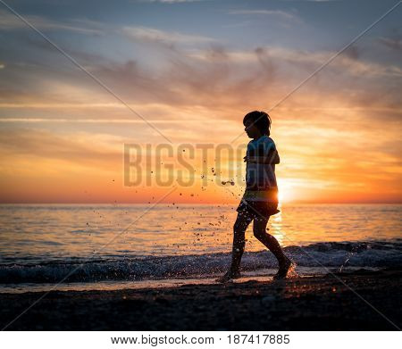 Happy boy enjoying the beach