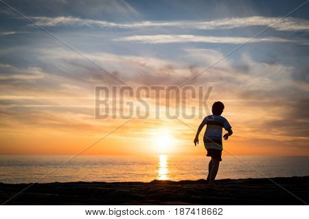 Happy boy enjoying the beach