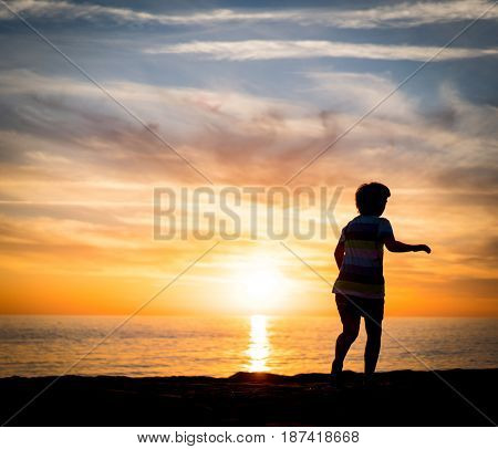 Happy boy enjoying the beach