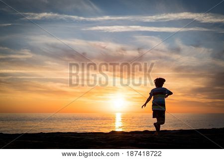 Happy boy enjoying the beach