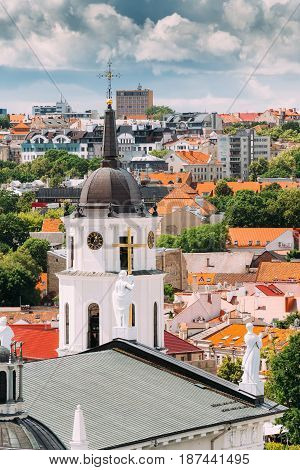 Vilnius, Lithuania. Bell Tower Near Cathedral Basilica Of St. Stanislaus And St. Vladislav At Sunny Summer Day. Beautiful View Of Old Town Under Dramatic Sky. Vilnius Old Town Is Part Of UNESCO World Heritage