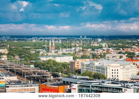 Riga, Latvia - July 1, 2016: Aerial Cityscape In Sunny Summer Day. Top View Of Landmarks - Riga Central Station, St. Francis Church, Ministry Of Transportation And All Saints Church.