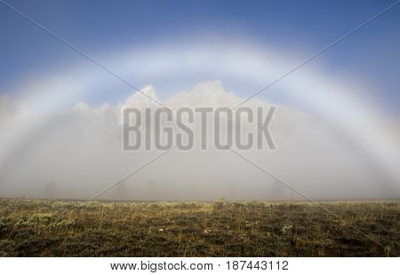 Fogbow Forms Over The Tetons On A Foggy Evening