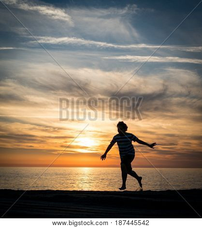 Happy boy enjoying the beach