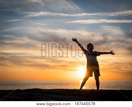 Happy boy enjoying the beach
