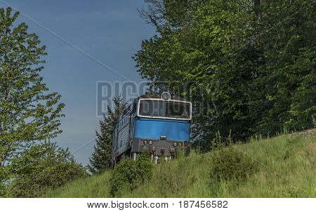Blue engine in green spring day near Jiretin village