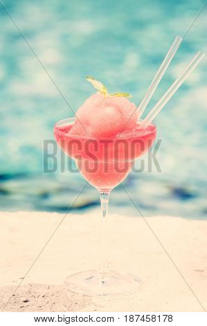 Frozen Strawberry Margarita Cocktail At The Edge Of A Resort Pool.  Concept Of Luxury Vacation