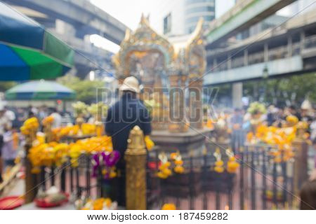 defocused scene of Erawan shrine in Ratchaprasong Junction in Bangkok Thailand. Erawan shrine is famous place in Ratchaprasong area