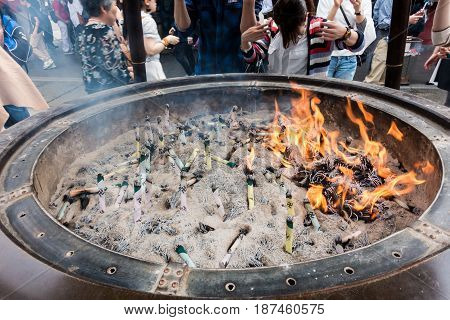 Tokyo Japan - May 1 2017: Tourists and Local are worshiping the shrine through the incense in Sensoji Shrine.
