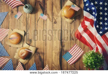 Patriotic holiday. USA are celebrate 4th of July. Top view with American flag on the table.