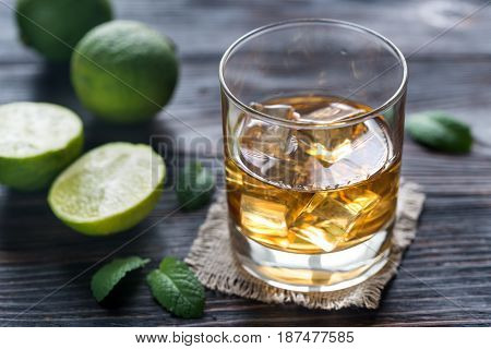 Glass Of Rum On The Wooden Background