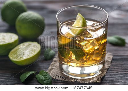 Glass Of Rum On The Wooden Background