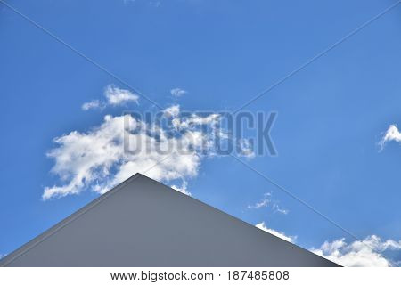 Scenery of sunny blue sky and triangular roof