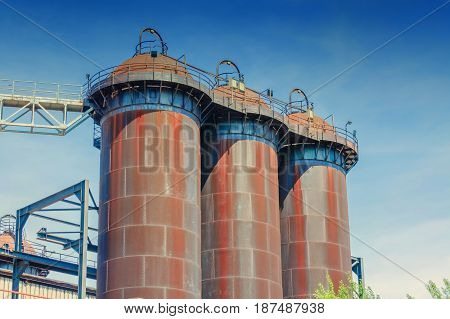 General view of an industrial plant refinery consisting of pipes and towers of heavy industry.