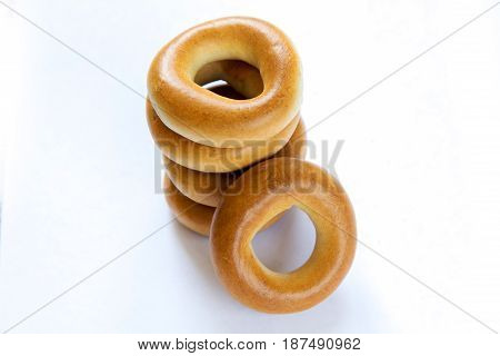Pile of dry bagels isloated on white background