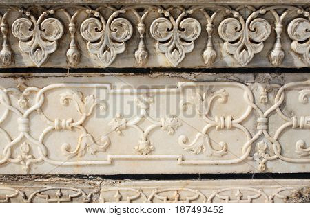 Ancient carved flower on marble in Taj Mahal mausoleum, Agra, India