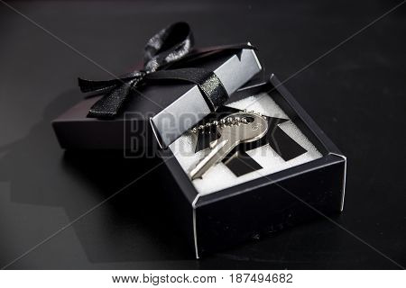 Black gift box with apartment keys - own housing